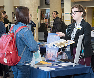 Student speaking to a representative for a four year university at a career fail in Bonnell. 